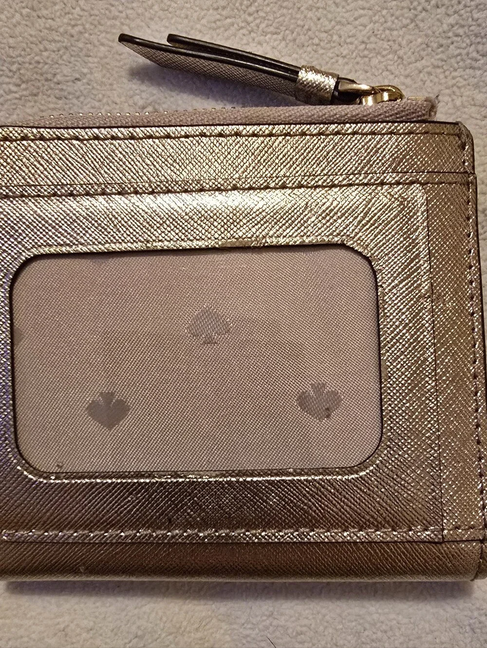 Kate Spade New York Staci small zip-around bifold wallet featuring a glittery ro